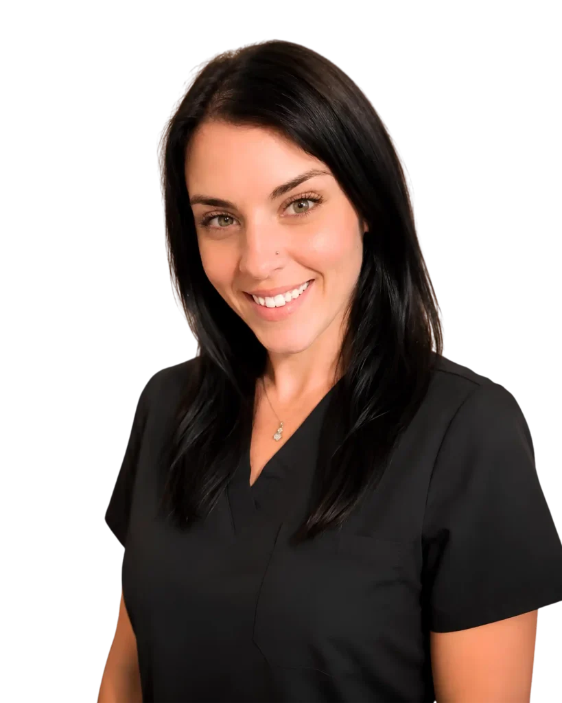 Smiling woman in black scrubs, portrait against a black background, healthcare professional.
