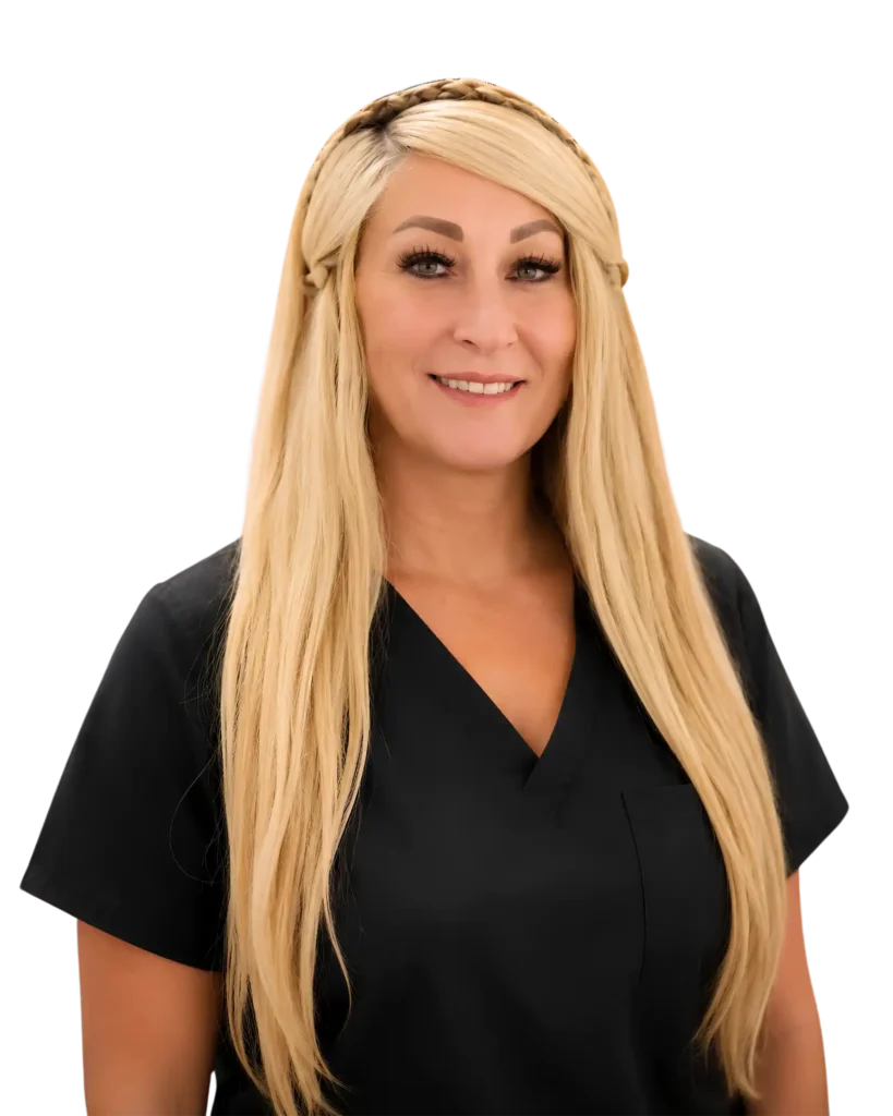 Smiling woman in black medical scrubs with long blonde hair, isolated on black background.